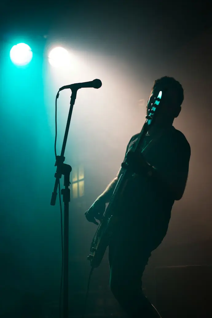 man holding electric guitar